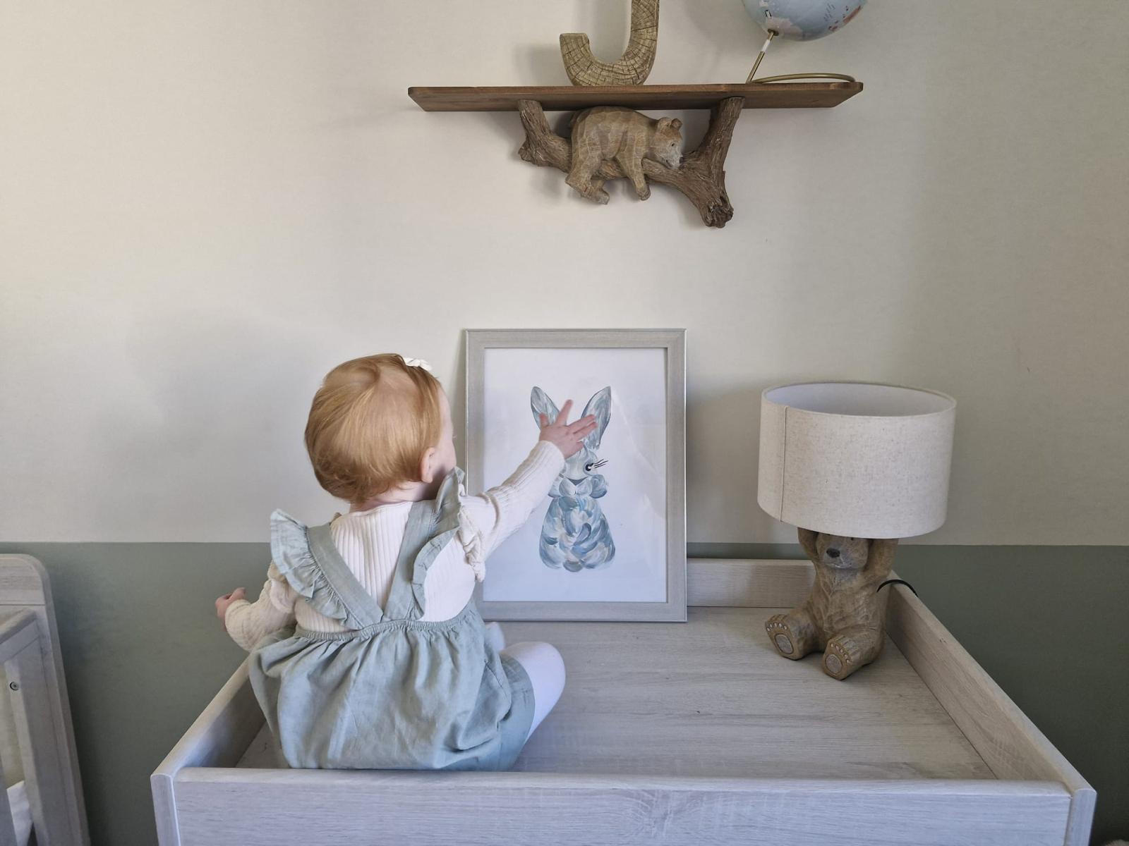 blue rabbit beth sitting hand up.jpeg__PID:f16507f2-8ecf-4dea-b0ec-34ede00321f3